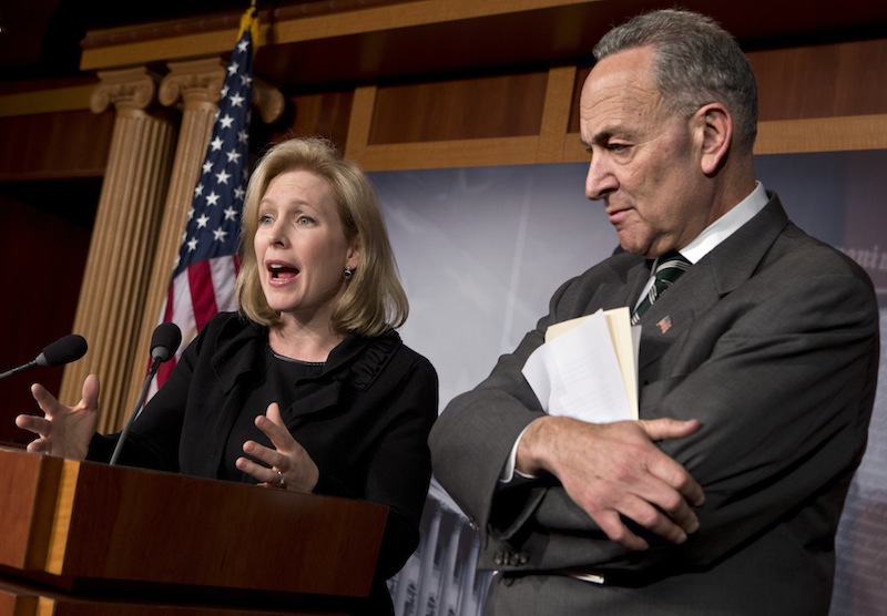 Sen. Kirsten Gillibrand, D-N.Y., left, and Sen. Charles Schumer, D-N.Y., right, react after the Senate passed a $50.5 billion emergency relief measure for Superstorm Sandy victims at the Capitol in Washington, Monday, Jan. 28, 2013. Three months after Superstorm Sandy devastated coastal areas in much of the Northeast, the Senate is finaly sending a $50.5 billion emergency package of relief and recovery aid to President Obama for his signature. (AP Photo/J. Scott Applewhite)