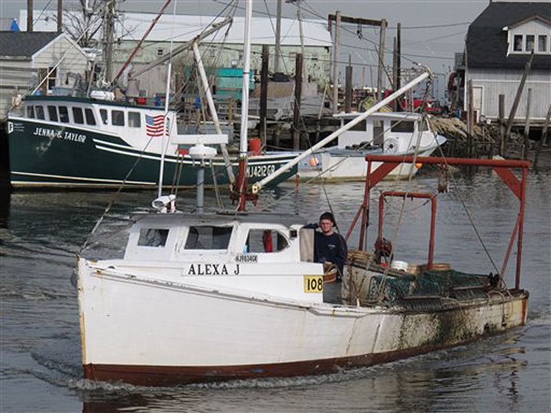 A fishing boat returns to the damaged Belford port in Middletown N.J., on Dec. 12, 2012. The port sustained nearly $1 million in damages from Superstorm Sandy, some of which its owners hope to recoup through federal storm aid.