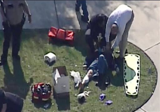 In this frame grab provided by KPRC-TV in Houston, an unidentified person is attended to by emergency personnel at Lone Star College on Tuesday.