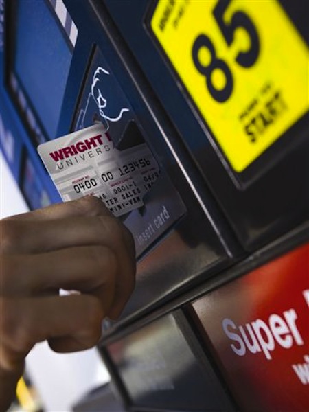 A Wright Express credit card is used at an ExxonMobil gas station.