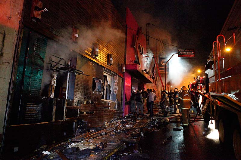 Firefighters work to douse a fire at the Kiss Club in Santa Maria city, Rio Grande do Sul state, Brazil, on Sunday. Firefighters say that the death toll from a fire that swept through a crowded nightclub in southern Brazil has risen to 231. Officials say the fire broke out at the club while a band was performing.