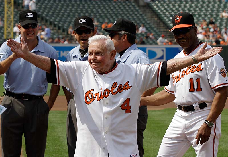 In this June 26, 2010 file photo, former Baltimore Orioles manager Earl Weaver waves to the crowd after taking the lineup card out before the start of a baseball game between the Orioles and Washington Nationals, in Baltimore, as members of the Orioles' 1970 team were honored before the start of the game. Weaver, the fiery Hall of Fame manager who won 1,480 games with the Baltimore Orioles, has died, the team announced on Saturday. He was 82.