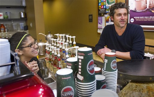 Patrick Dempsey's investment group has won the bid to purchase Tully's Coffee. Dempsey meets the staff at the Tully's Coffee on Western Avenue near the Pike Place Market on Friday, Jan. 4, 2013. (AP Photo/The Seattle Times, Mike Siegel)