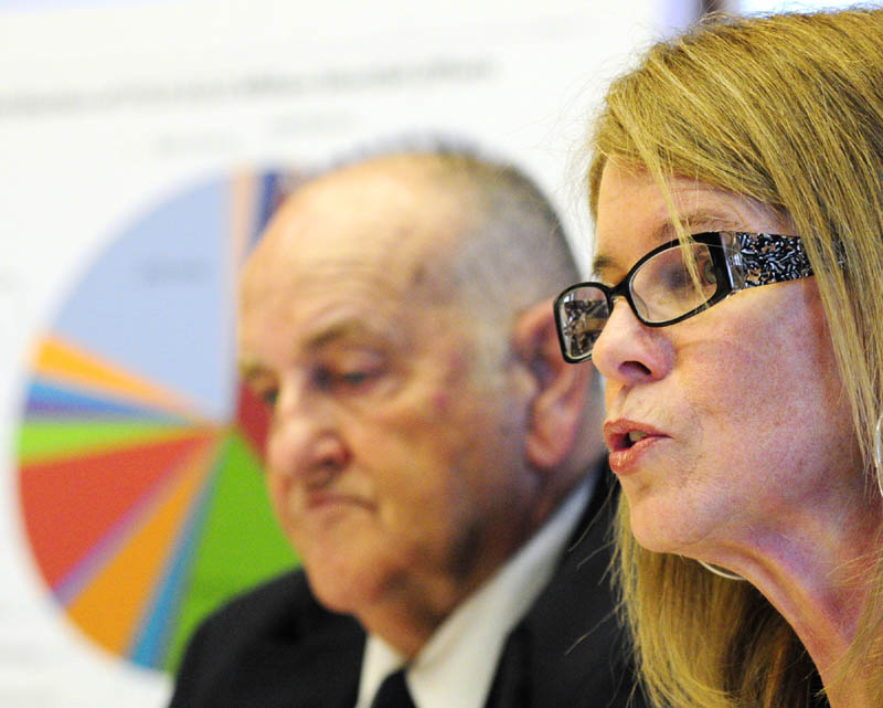 Sawin Millett, the commissioner of administrative and financial services, and Mary Mayhew, health and human services commissioner, at a news conference about Gov. LePage's budget proposal on Friday at the State House in Augusta.