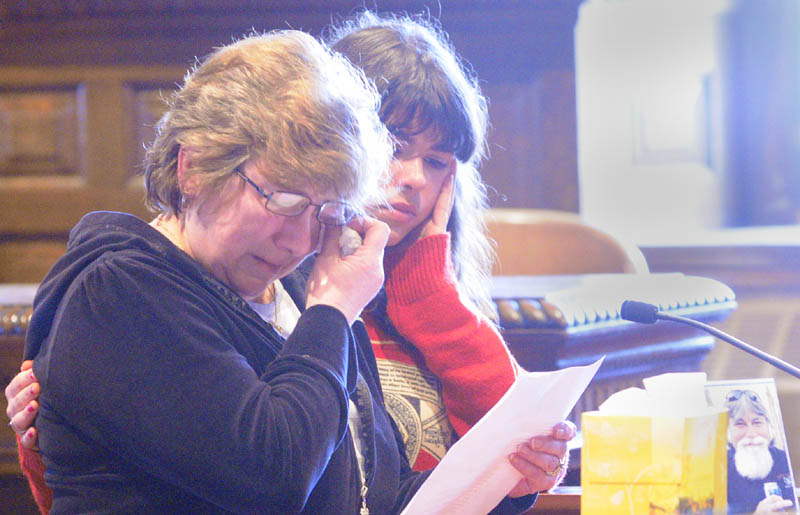 Janet Orr, left, is comforted by family friend Jodi Ferry as she speaks on Friday January 4, 2013 in Kennebec County Superior Courthouse in Augusta during the sentencing of David Silva who pled guilty of murdering her husband Robert Orr and burning down their Readfield home.