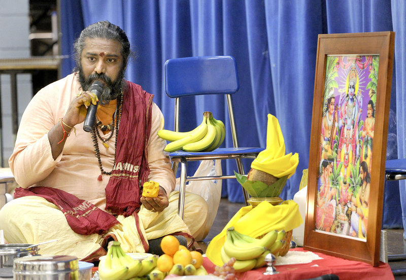 Sivacharia Bhairav Sundaram Battar leads a service called a "puja" at Riverton Elementary School on Dec. 1, 2012, at which members of the Maine Hindu Temple sought blessings on its efforts to buy a Westbrook building.