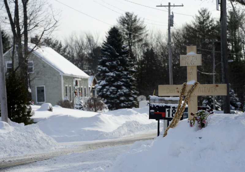 A makeshift memorial stands across from 17 Sokokis Road in Biddeford, where Derrick Thompson and Alivia Welch were shot dead on Dec. 29.