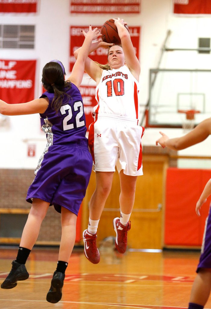 Danica Gleason of South Portland pulls up for a jump shot over Chelsea Saucier of Deering during Deering’s 45-37 victory Monday at Beal Gym. Saucier’s strong defense helped limit the high-scoring Gleason to nine points, with one late basket.