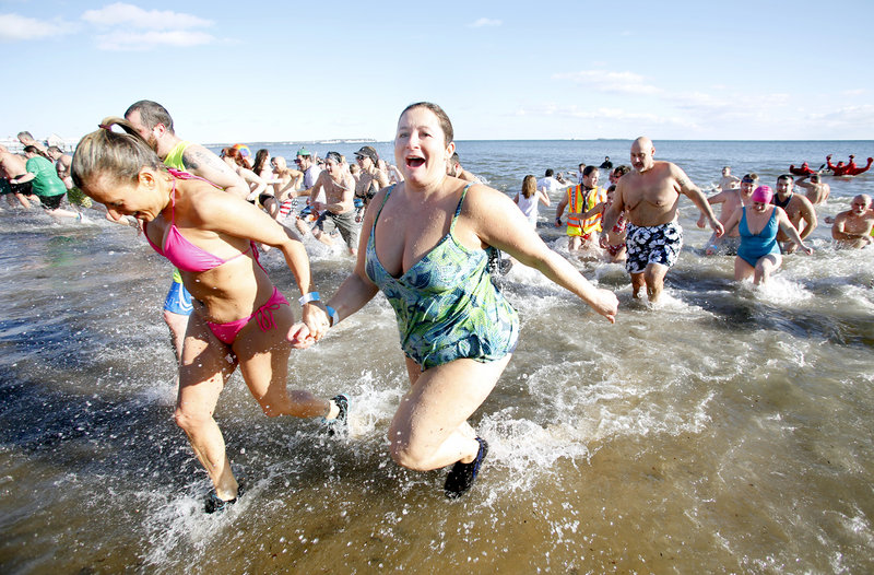 Hundreds take the plunge in the Atlantic Ocean during the 25th annual Lobster Dip to benefit Special Olympics Maine in Old Orchard Beach on Tuesday.