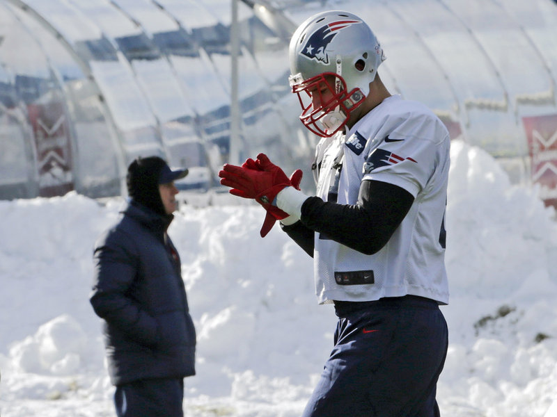 Tight end Aaron Hernandez gets ready to run a drill during a chilly New England Patriots practice session Wednesday in Foxborough, Mass.