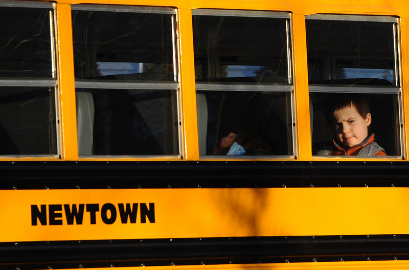 A Newtown bus leaves school Thursday in Monroe, Conn., after the first day of classes since the Dec. 14 massacre at Sandy Hook Elementary in Newtown. The vacant Chalk Hill School in Monroe was renamed Sandy Hook Elementary and overhauled to house the students.