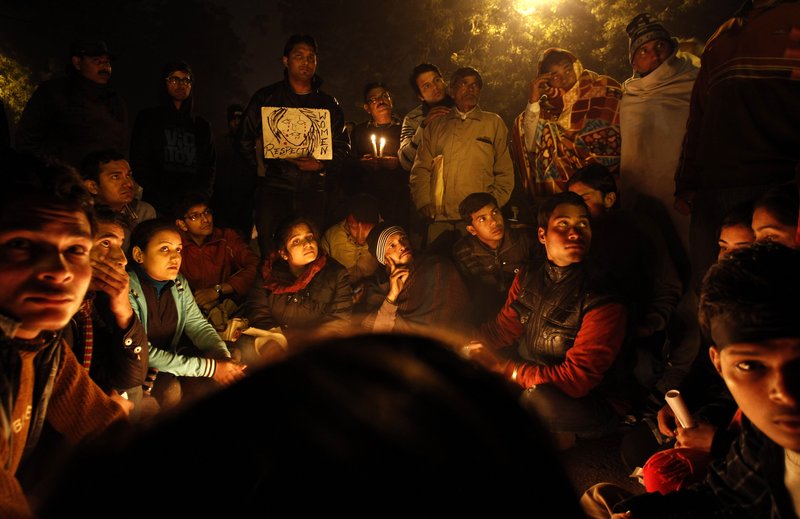 Indians gather for a candlelight vigil in memory of a gang-rape victim in New Delhi on Thursday. Five men face charges in the gang rape and death of a woman last month in India’s capital.