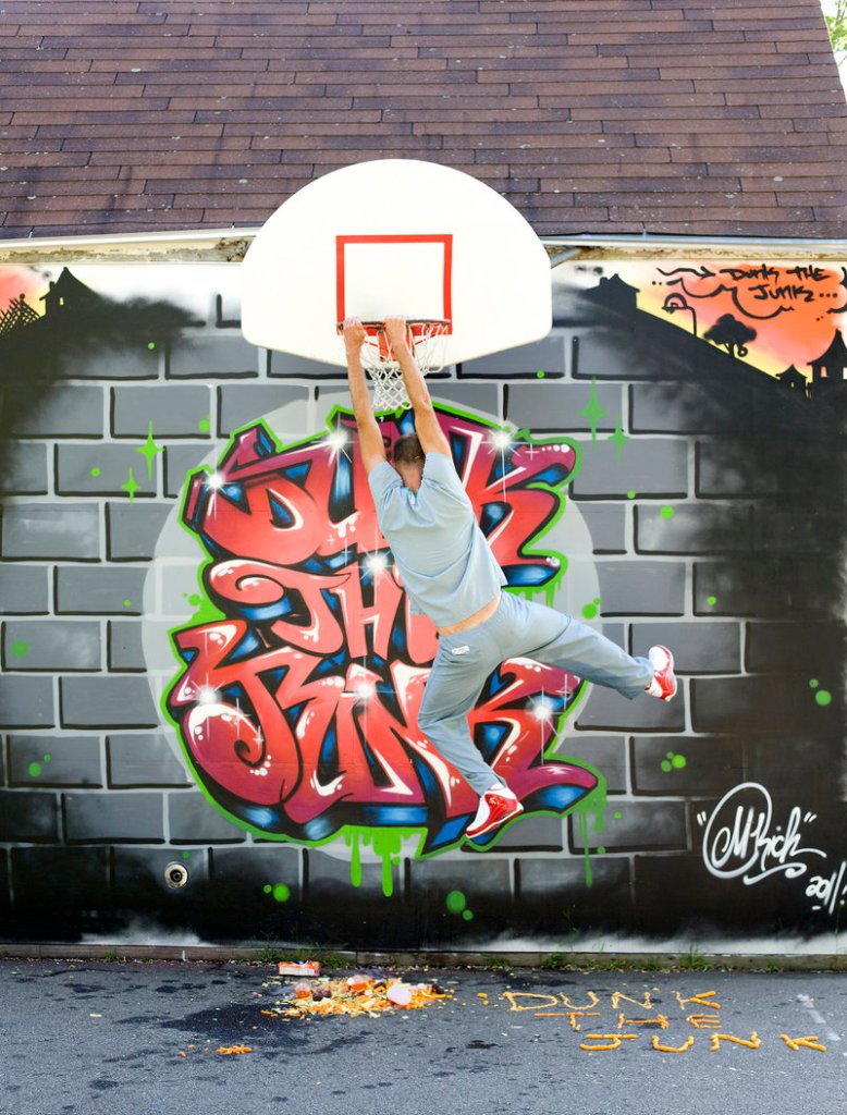 Dr. Kevin Strong slam-dunks junk food through a basketball hoop in front of a mural painted by Portland artist Mike Rich. More of Rich’s work can be seen at mikerichdesign.com.