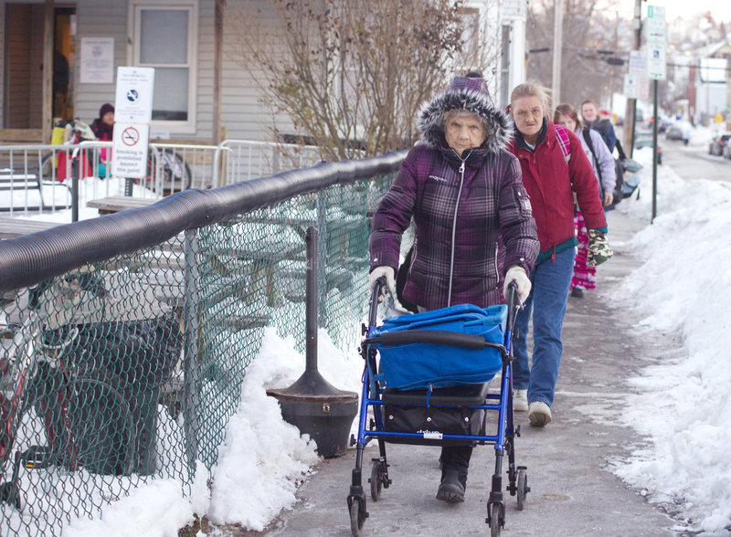 Viola Silver, 89, and her daughter, Saralyn Silver, 56, walk down Oxford Street Thursday after a night at the Oxford Street Shelter.