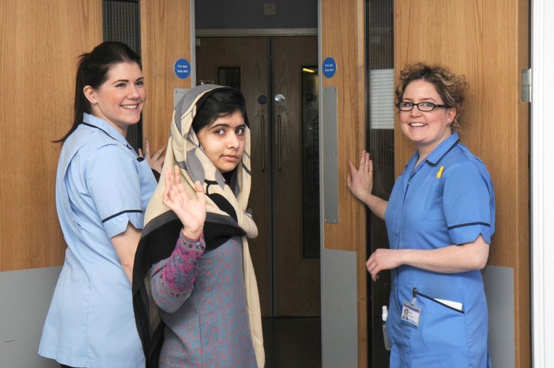 Malala Yousufzai waves goodbye as she leaves Queen Elizabeth Hospital in Birmingham, England, Friday. Experts are optimistic she has a good chance of recovery.