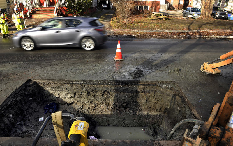 Crews work to repair a water main break on Dartmouth Street in Portland on Dec. 20. “The $8 billion a month now wasted in Afghanistan would fix a lot of pipes across the nation,” a reader says.