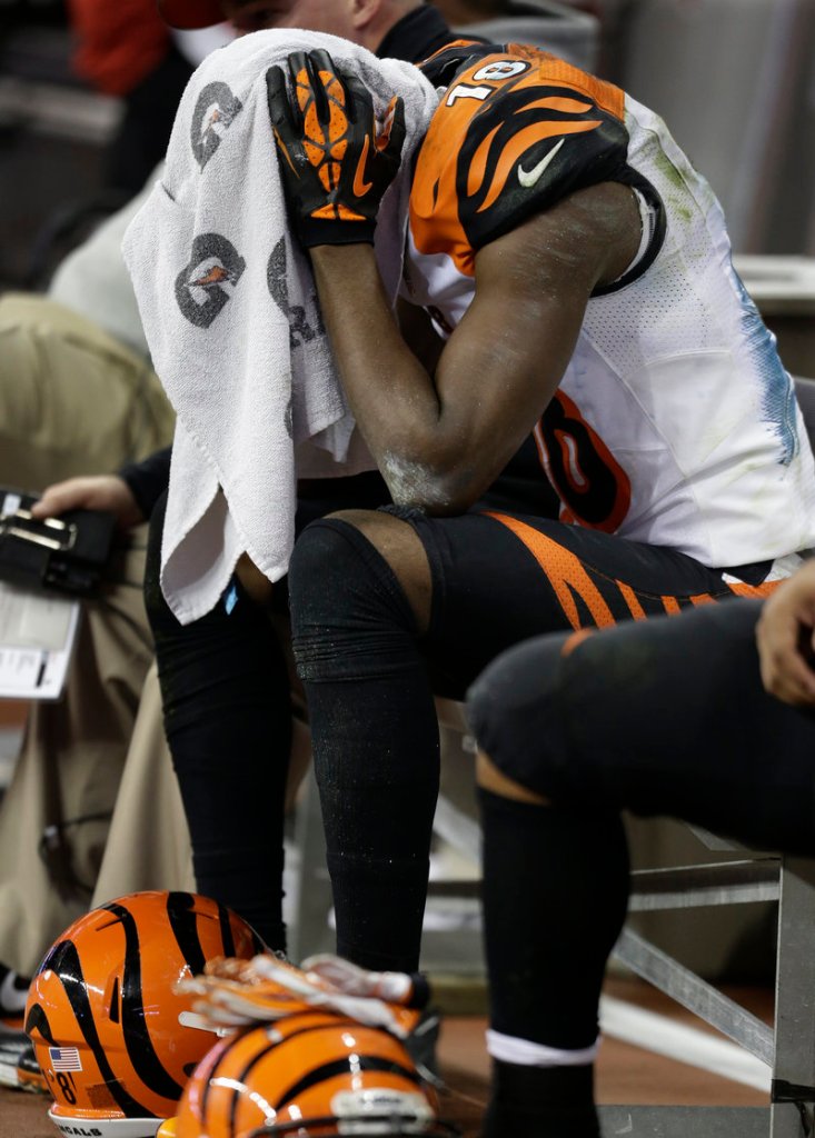 A.J. Green, Cincinnati wide receiver, feels the agony of defeat in the waning moments of Saturday’s playoff loss to Houston.