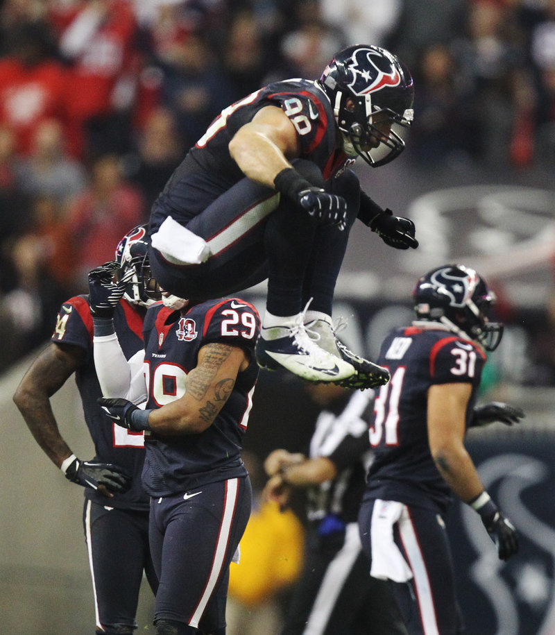 Houston linebacker Connor Barwin jumps for joy after stopping a Cincinnati drive during the fourth quarter of Saturday’s game, won by the Texans.
