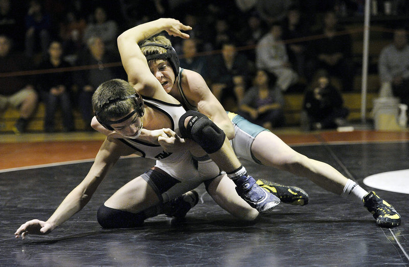 Tyler Everett of Massabesic controls his match against Ryan Peters of Timberlane High of Plaistow, N.H. Everett won the 126-pound division by defeating Peters, 6-4.