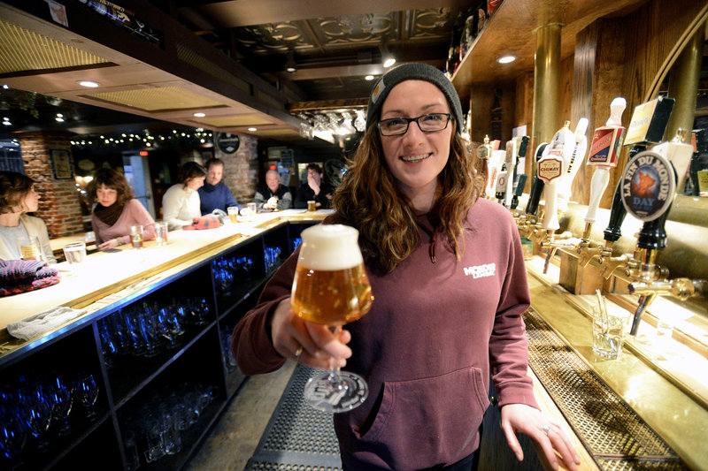 Erika Colby, a bartender at Novare Res Bier Cafe, shows off a Bavik Petrus Aged Pale Ale.