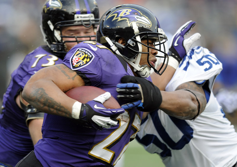Ravens running back Ray Rice (27) is a hit by Colts linebacker Jerrell Freeman (50). Rice had 70 yards on 15 carries and a 47-yard reception.