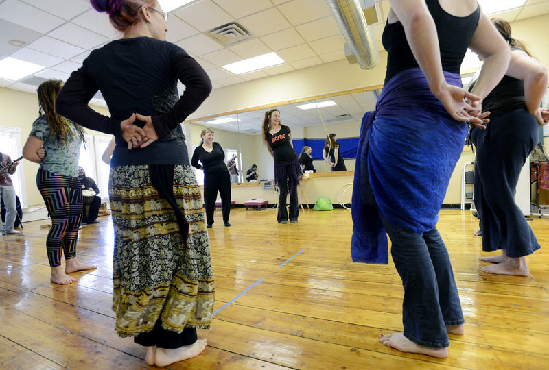 Joie Grandbois, center, demonstrates theatrical belly dancing at Bright Star World Dance in Portland.