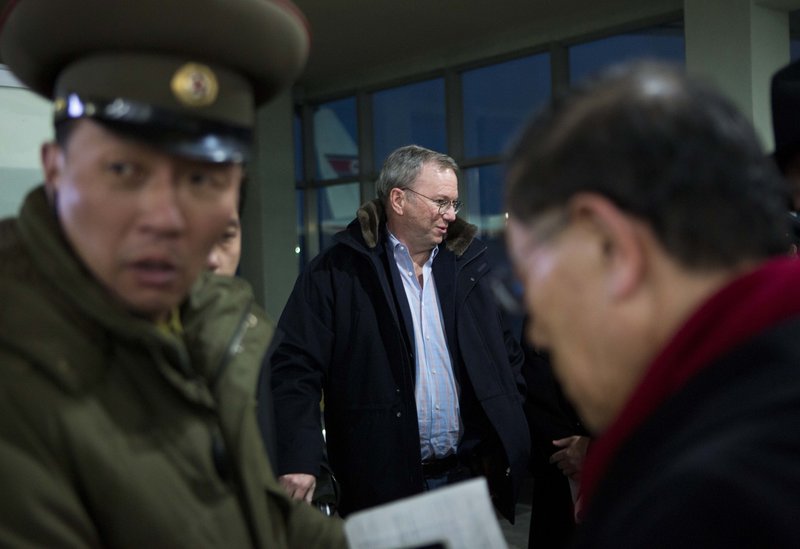 Eric Schmidt, executive chairman of Google, center, arrives at the airport in Pyongyang, North Korea, on Monday. He is the highest profile U.S. executive to visit the country.