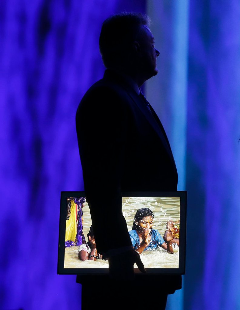 Panasonic’s CEO North America Joe Taylor holds a 20-inch 4K tablet during a keynote address at the Consumer Electronics Show Tuesday.