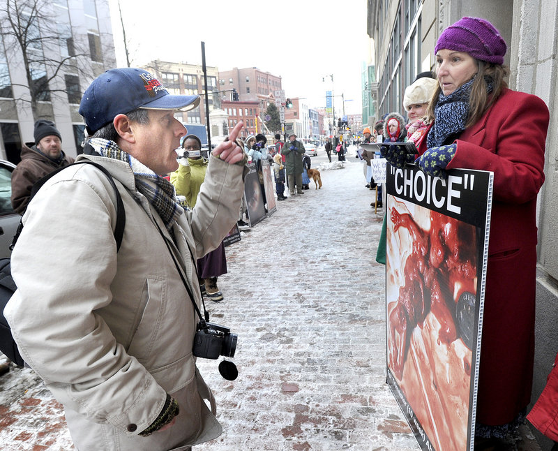Louis Sigel, left, a pro-abortion rights protester, exchanges words with anti-abortion protester Leslie Sneddon outside Planned Parenthood in Portland at a rally Jan. 4 organized by a business owner who said he’s trying to dislodge the weekly anti-abortion pickets. Readers debate whether the weekly protests are examples of peaceful speech or harassment.