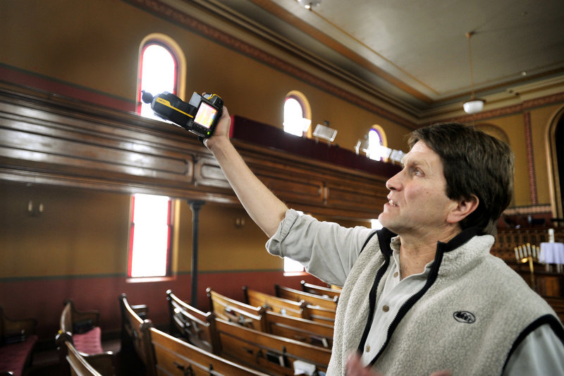 Friday, January 11, 2013: Energy consultant DeWitt Kimball uses a thermal energy sensor to look for heat leaks in the church building.