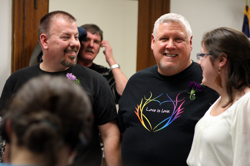 Steven Bridges, left, and Michael Snell at Portland’s City Hall on Dec. 28, the night they wed.