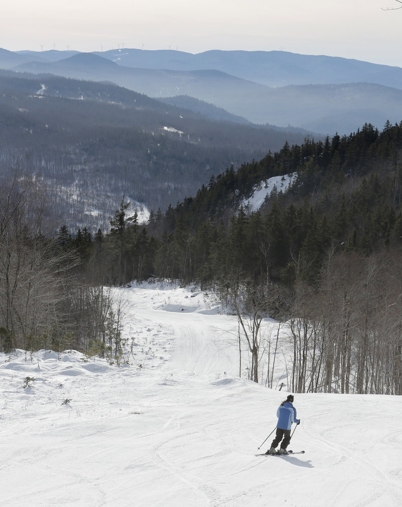 Paige Carter, marketing director of Black Mountain, skis the Allagash Trail, which offers a panoramic view of neighboring mountain ranges.