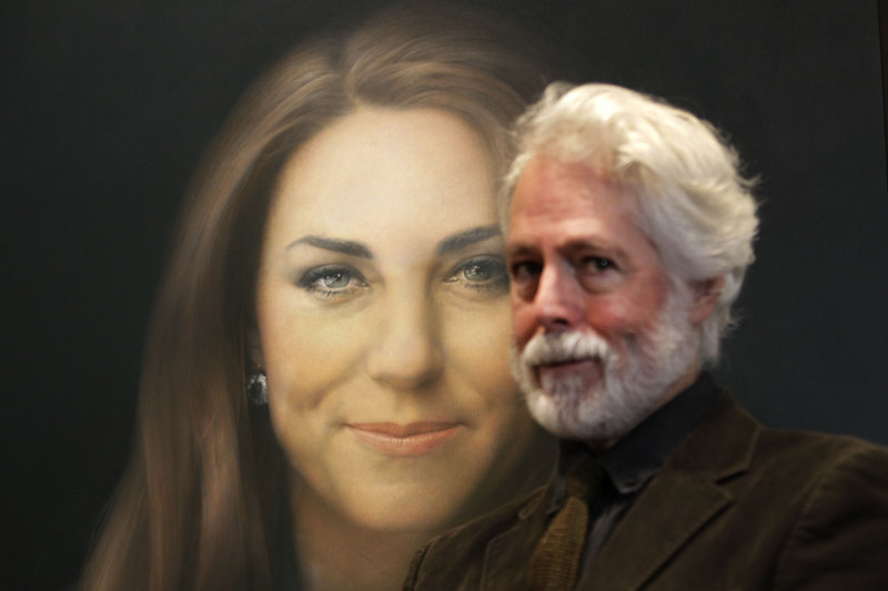 Paul Emsley poses next to his newly commissioned portrait of Kate, Duchess of Cambridge, on display Friday at the National Portrait Gallery in London.