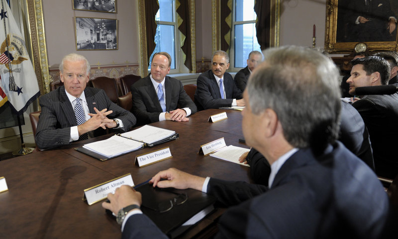 Vice President Joe Biden, left, speaks at a meeting on gun violence prevention with representatives of the video game industry and administration officials Friday in Washington.