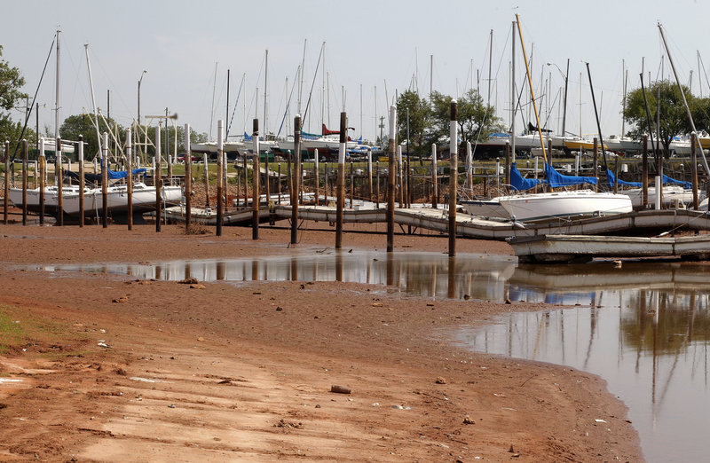 This harbor on Lake Hefner in Oklahoma City is nearly dry in September. The latest climate assessment, issued every four years, gives a bracing picture of environmental changes and natural disasters that mounting scientific evidence indicates is fostered by climate change.