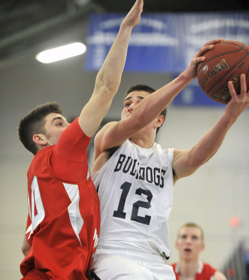 Justin Zukowski drives to the basket Friday during Portland’s 63-47 win over South Portland. The Bulldogs are 10-0 and ranked first in Western Class A.