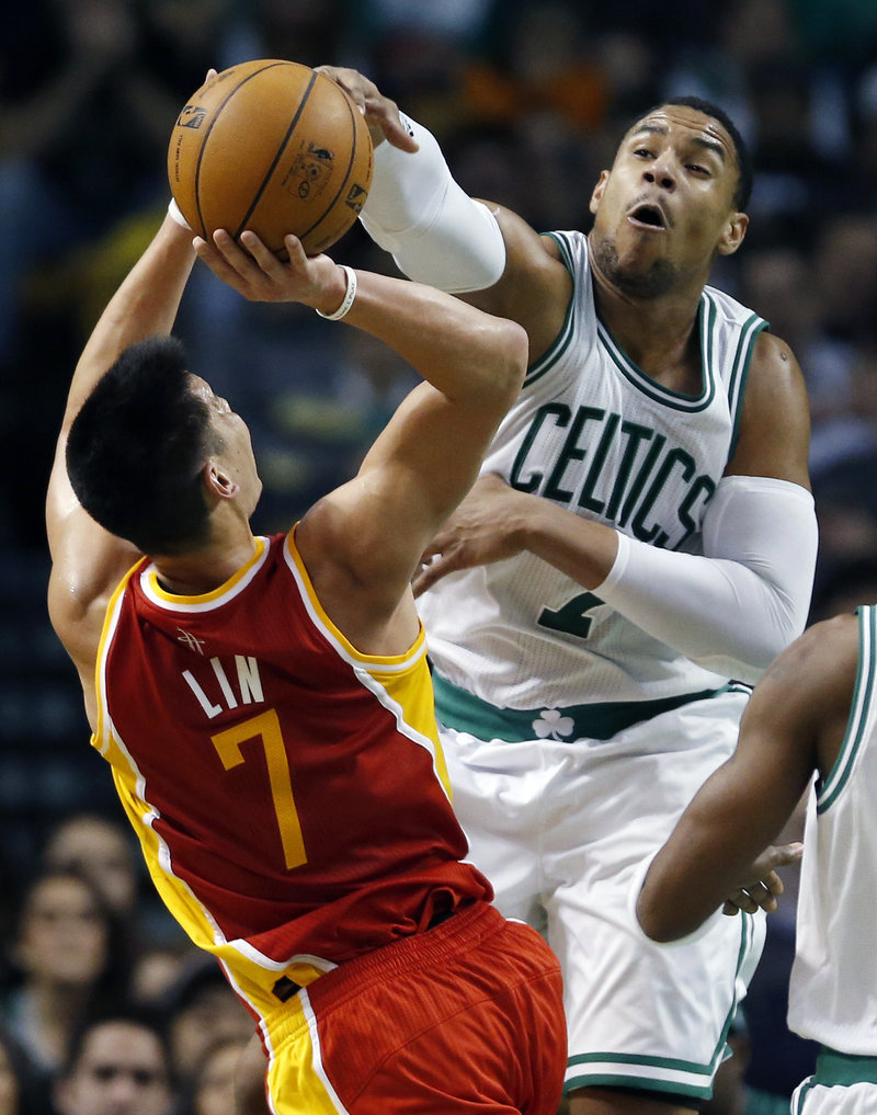Celtics center Jared Sullinger blocks a shot by Houston’s Jeremy Lin during third-quarter action of Friday’s game in Boston, won by the Celtics.