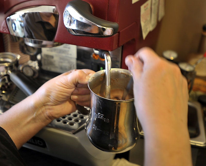 Marguerite Swoboda uses the frother on her espresso machine to make her salted caramel hot chocolate.