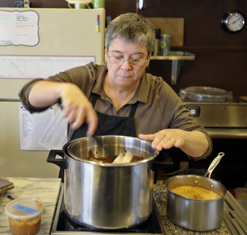 Marguerite Swoboda of Sweet Marguerites in South Portland melts chocolate that she’ll use in her salted caramel hot chocolate.