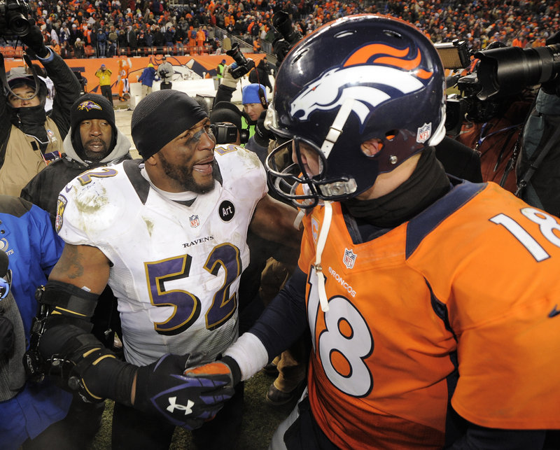 Ray Lewis of the Baltimore Ravens, left, shakes hands with Denever quarterback Peyton Manning following Baltimore’s 38-35 victory Saturday in double overtime.