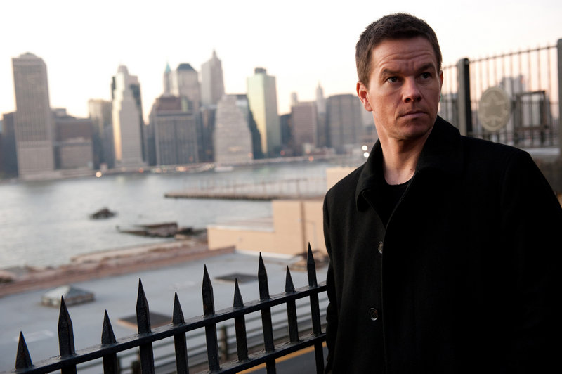 Mark Wahlberg, above, stars as private investigator Billy Taggart, who is hired by New York’s mayor, played by Russell Crowe, below, to follow his wife, played by Catherine Zeta-Jones.
