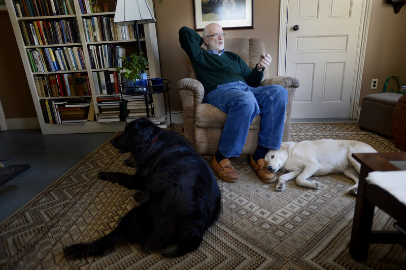 Wesley McNair at home in Mercer with his dogs Gus, left, and Rosie.