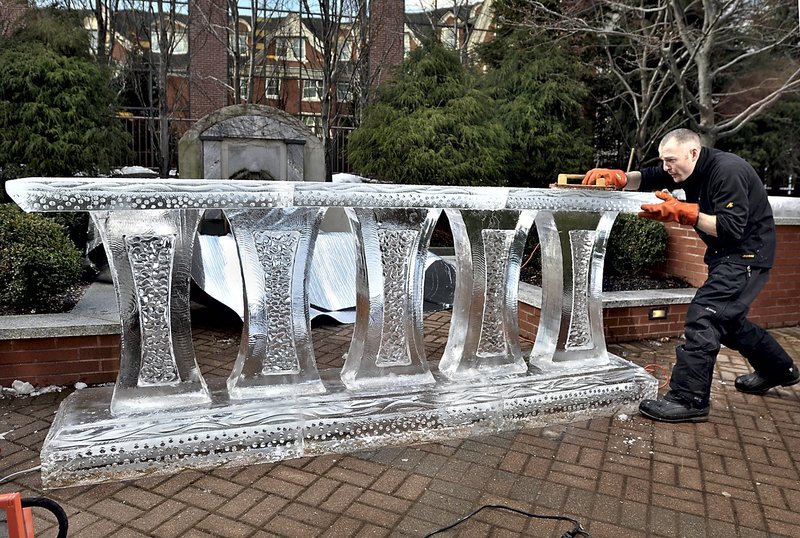 Earl Morse puts the finishing touches on the ornate base of Portland Harbor Hotel’s ice bar in 2010.