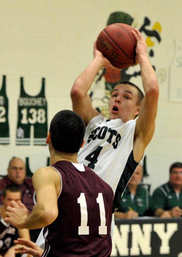 Dustin Cole of Bonny Eagle lifts for a 3-pointer while defended by Jacopo Secchi of Windham. Cole scored a game-high 28 points and added seven assists for the Scots.