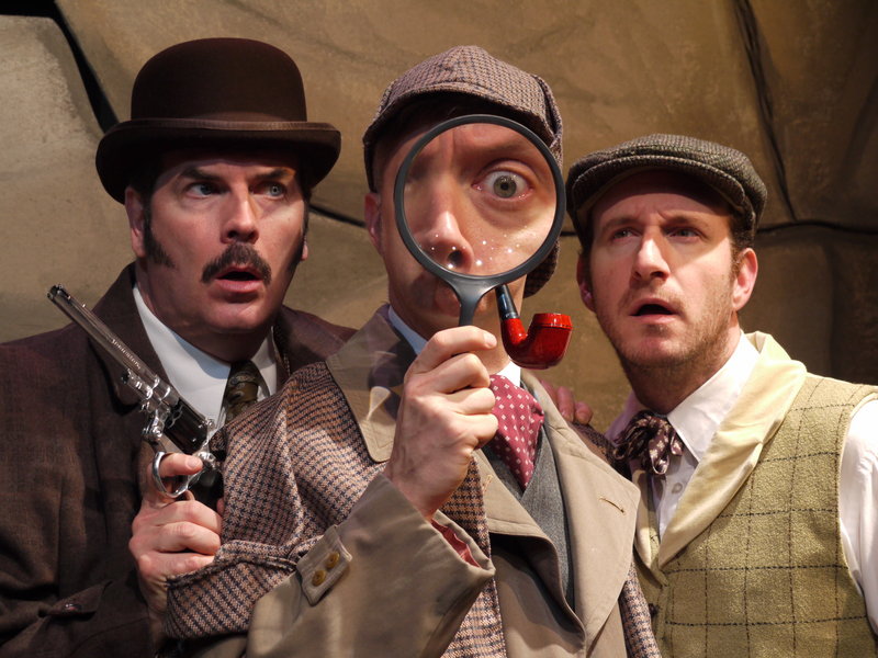 Looking for a clue in The Public Theatre’s “The Hound of the Baskervilles” are J.T. O’Connor as Watson, Michael Frederic as Holmes and Dan Matisa as Sir Henry Baskerville.