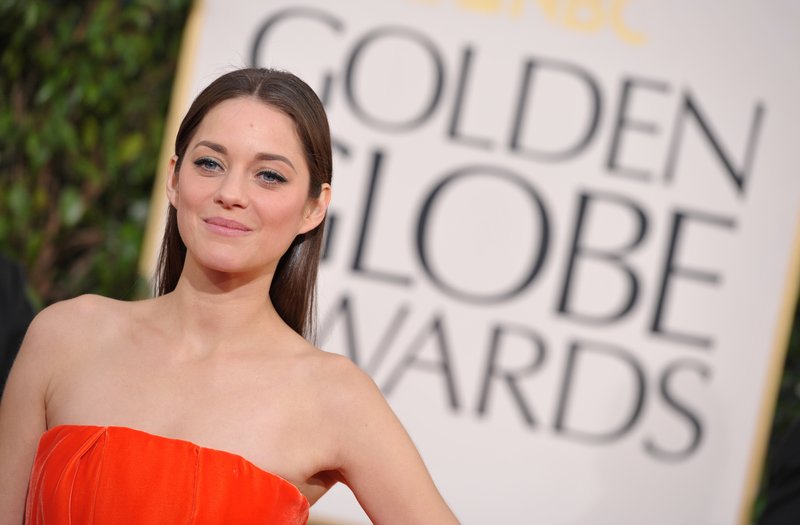 Actress Marion Cotillard arrives at the 70th annual Golden Globe Awards at the Beverly Hilton Hotel on Sunday in Beverly Hills, Calif.