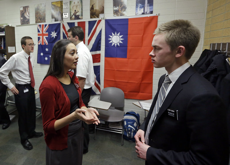 Mormon missionaries Mikaela Merrill, 19, left, and Harrison Surdu practice their Mandarin Chinese during a class at the Missionary Training Center in Provo, Utah.