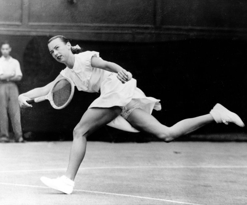Gertrude “Gussie” Moran races to make a shot in 1949 at Wimbledon in London. She lost the match, but her fashion statement appeared on magazine covers around the world.