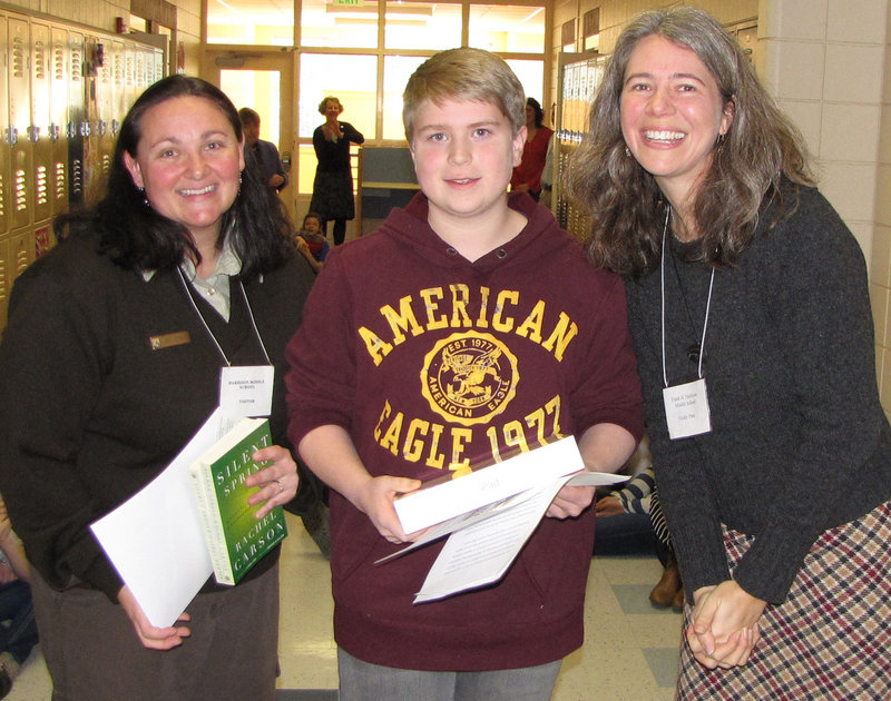 Nick Prato, a seventh-grader at Frank Harrison Middle School in Yarmouth, won the top prize in a statewide Silent Spring essay contest. With him are Karrie Schwaab, Rachel Carson National Wildlife Refuge, left, and Suzanne Kahn Eder, Wells Reserve at Laudholm. Other top winners were Drake Janes of Adams School in Castine, and Crystal Bell and Samantha McIntyre, both of Holbrook Middle School in Holden. The winners were selected from 257 essays, submitted from 24 schools across the state. Nineteen honorable mentions also were awarded.