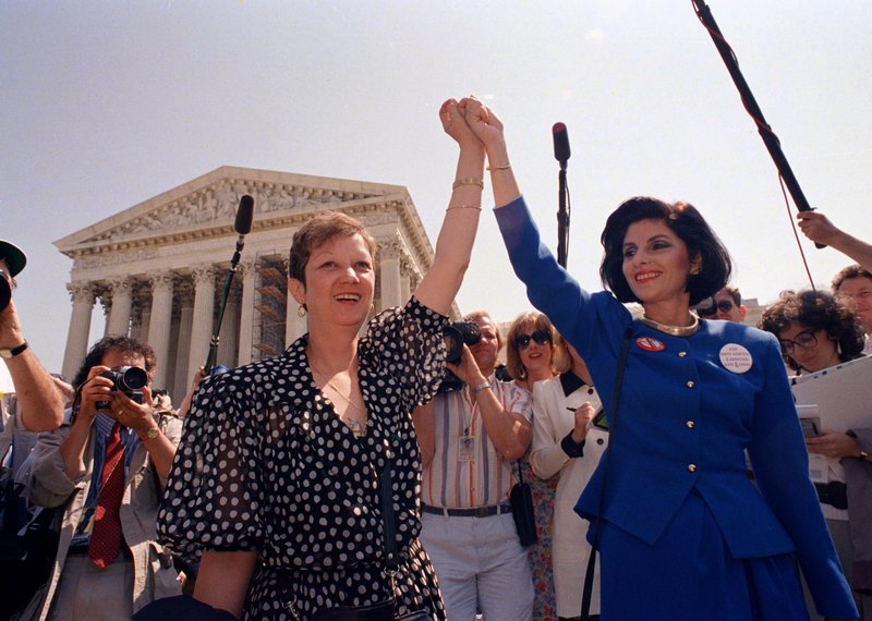 Norma McCorvey, Jane Roe in the 1973 court case, left, and her attorney Gloria Allred leave the Supreme Court building in Washington in 1989 after sitting in while the court heard a Missouri abortion case.